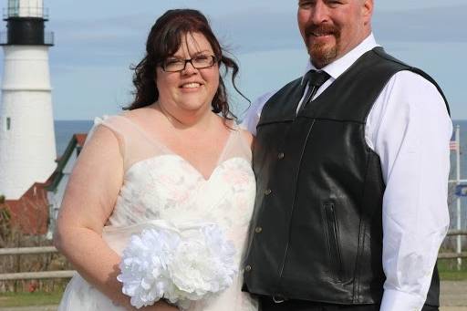 This couple embrace over a lake