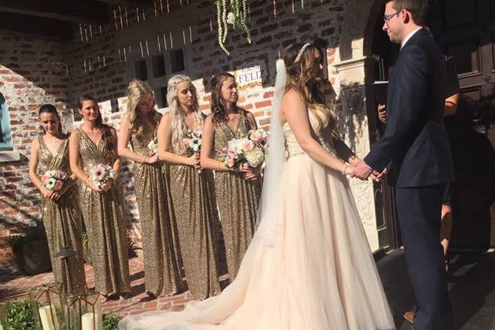 Officiant with the bride and groom