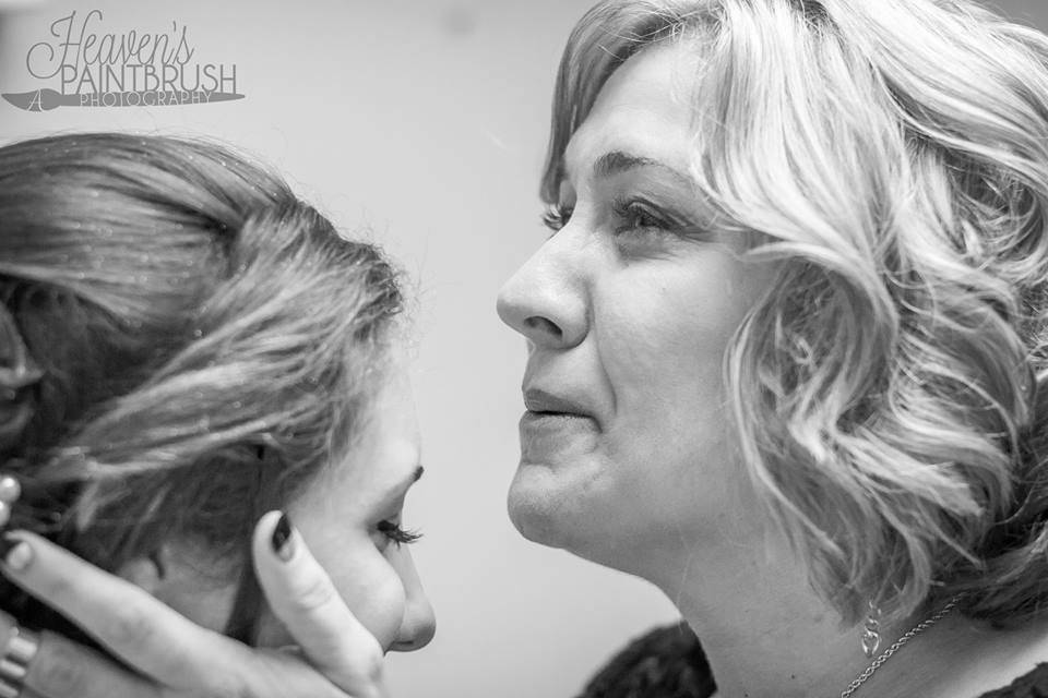 The mother of the bride and the bride sharing a tender moment, just after the mother had zipped up the wedding dress and sees her little girl ready to walk down the aisle!