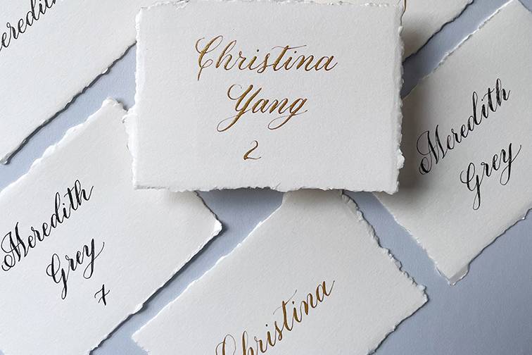 Gold ink calligraphy placecard