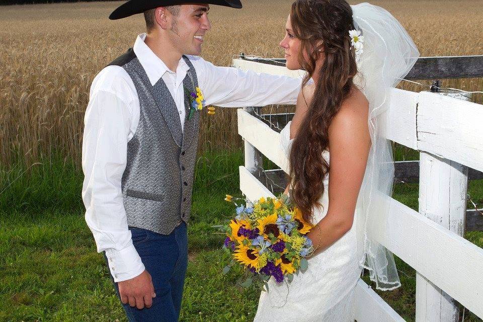 Groom and bride by the field