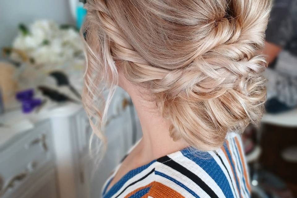 Pulled back low with braid