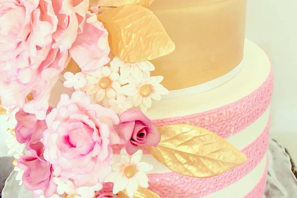 Three tier pink and gold cake