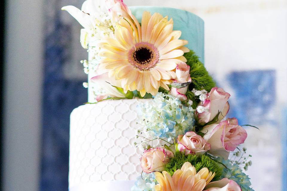 Three tier wedding cake with sunflowers