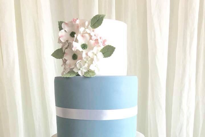 Four tier white and blue cake