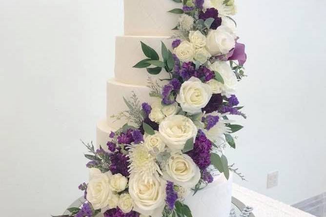 Six tier wedding cake with ascending flowers