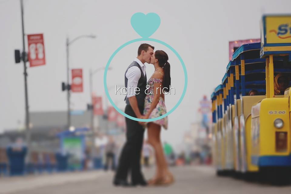 Couple kissing beside a tram