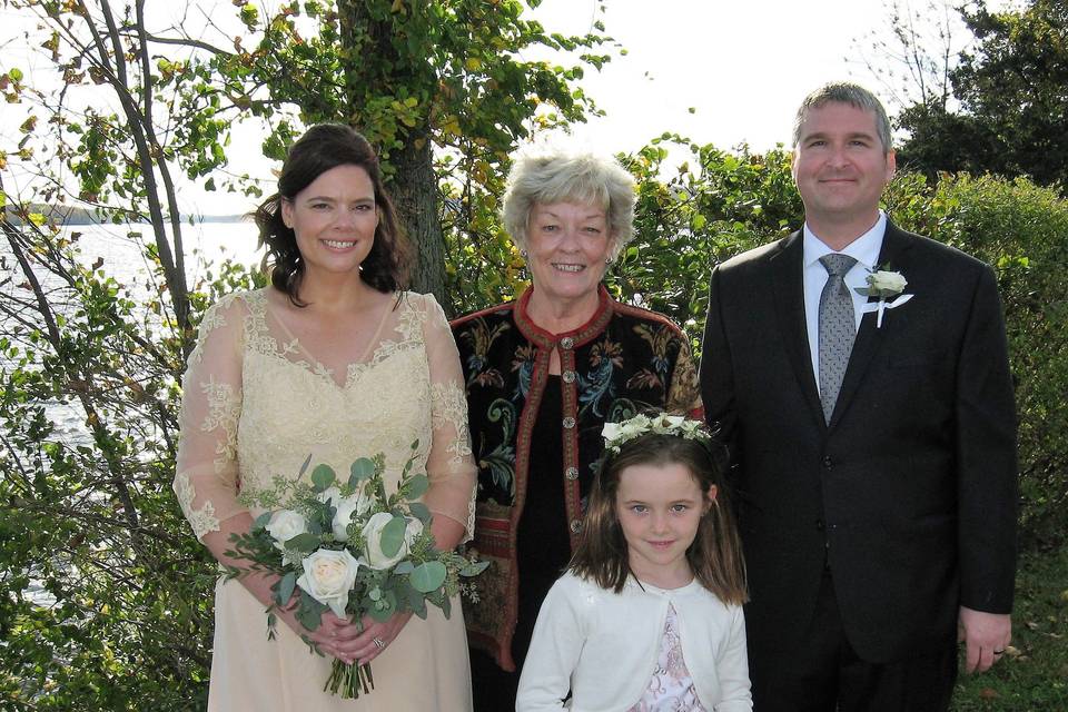 Group photo with the newlyweds and the flower girl