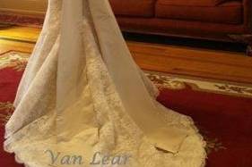 French Alencon lace gown with silk satin bow and sash.
