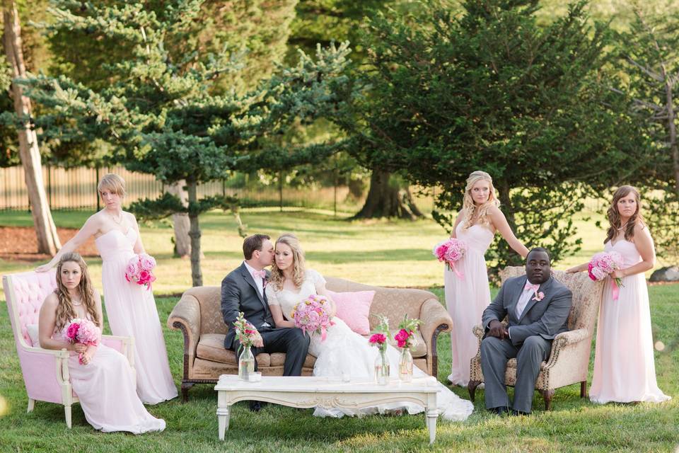 The couple with the bridesmaids and groomsmen