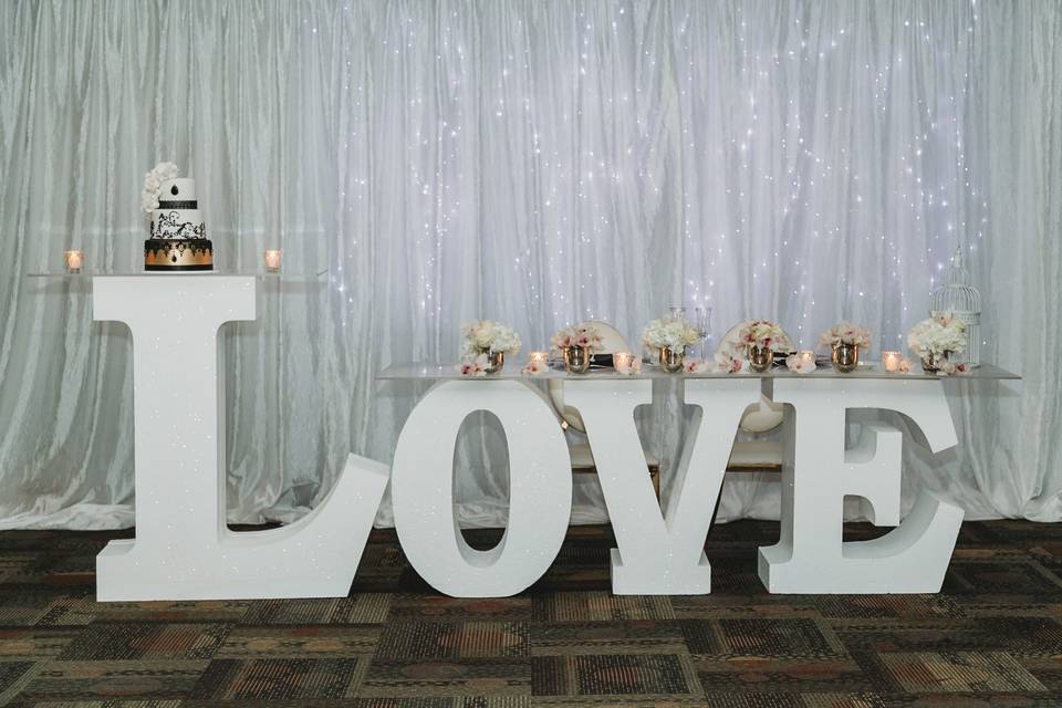 Cake and decor on love sign