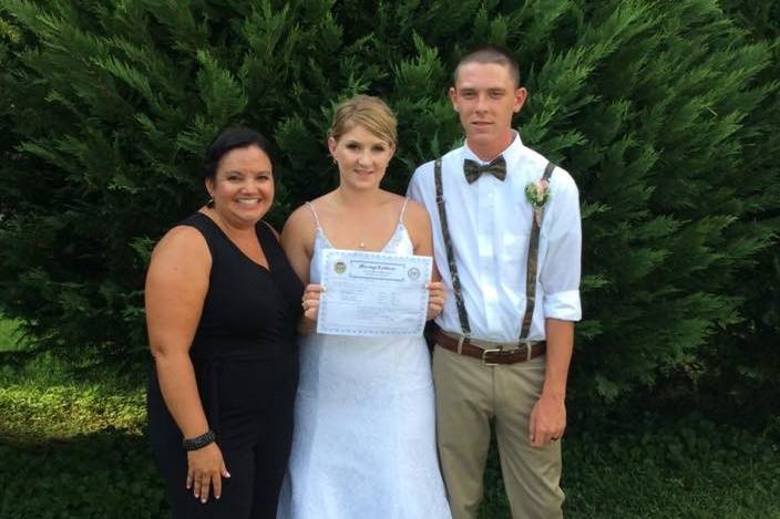 Couple photo with the officiant