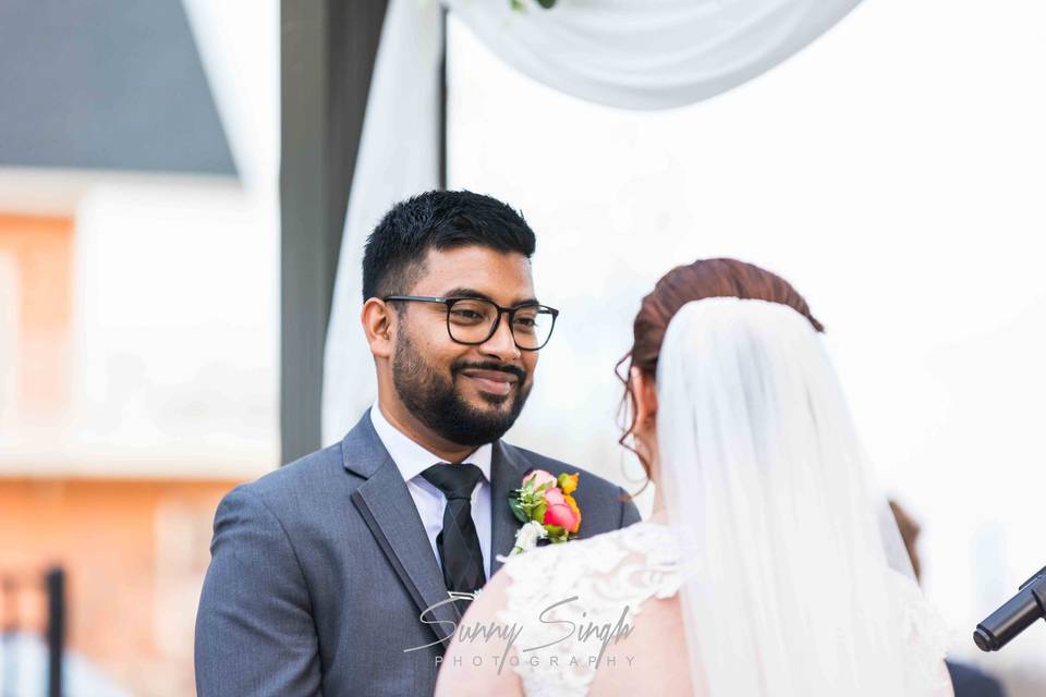 Groom's Loving Gaze During Cer