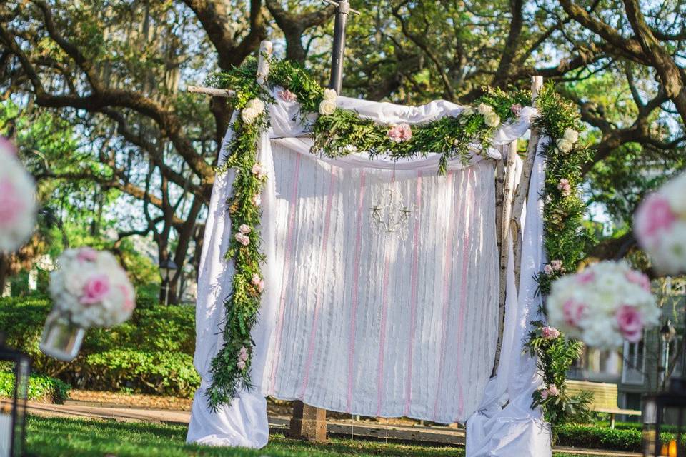 Custom Birch Arch, Floral Garland, Floral Jars, Bridal Flowers, Accent cabinet with flowers & Decor all provided by Coastal Creative's in-house designers!