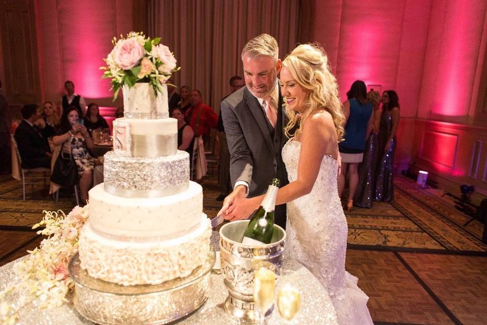 Happy couple cutting the cake