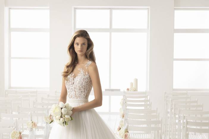 AIRE BARCELONA	BASORA		Ideal wedding dress for brides seeking simple elegance. The tulle, sheer lace, and beading combine flawlessly.