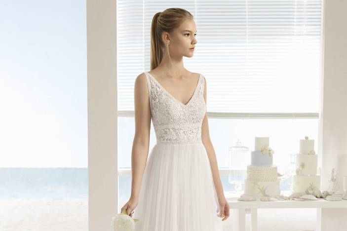 URUS	<br>	Lace bodice with alluring beaded back and flowing tulle skirt.