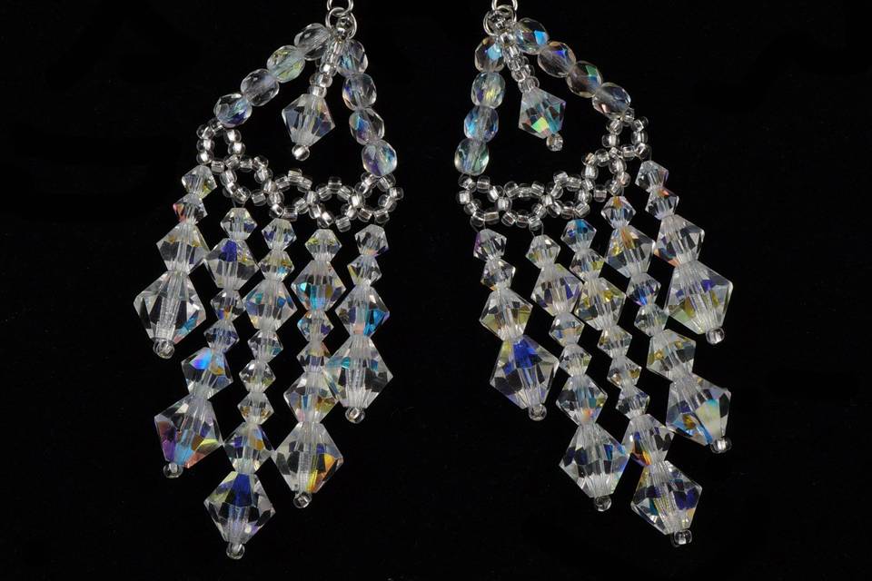 Chandelier earrings woven with silver Czech glass and Czech crystal.