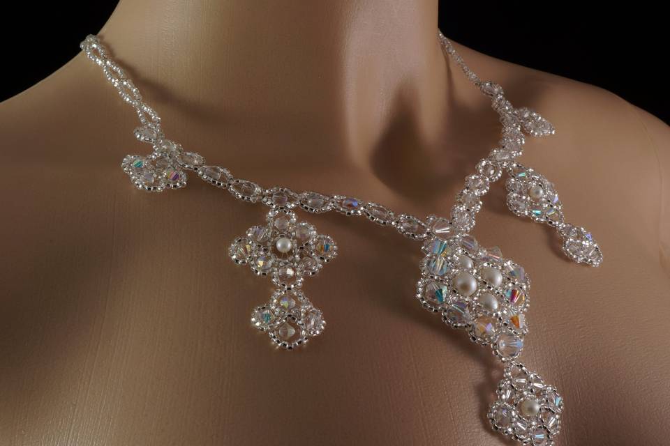 Dramatic tiered necklace woven with Celestial crystal, pearl and silver Czech glass.