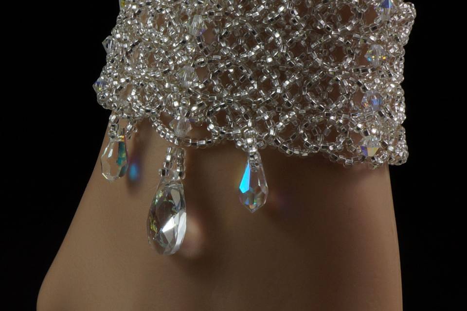 Stunning bracelet woven with Swarovski crystals, silver Czech glass and Swarovski white patina pear pendants.