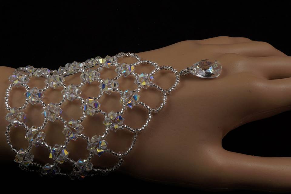 Stunning bracelet woven with Swarovski crystals, silver Czech glass and Swarovski white patina pear pendant.