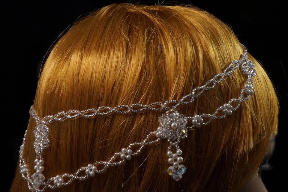 Stunning statement headpiece made with celestial crystal, pearl, and silver Czech glass.
