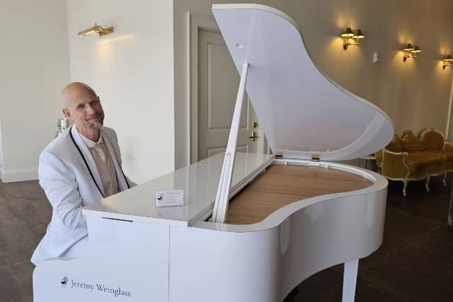 White baby grand piano shell