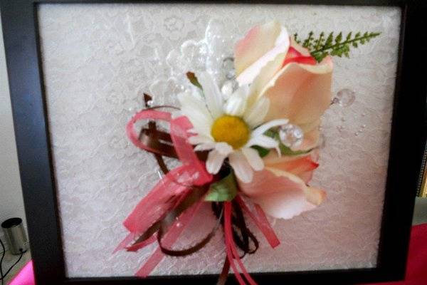 Mom's corsage.  Life touch rose with daisy, accented with victorian lace and brown, pink ribbons