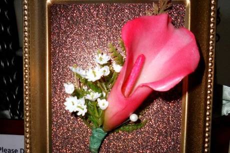 Calla boutonniere,with babys breath.  Simply stated.