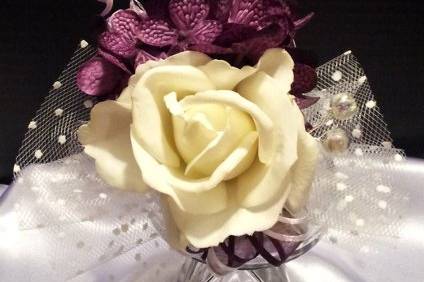 Diamond dusted mom's corsage with pearls, babys breath and sheer burgandy ribbon.