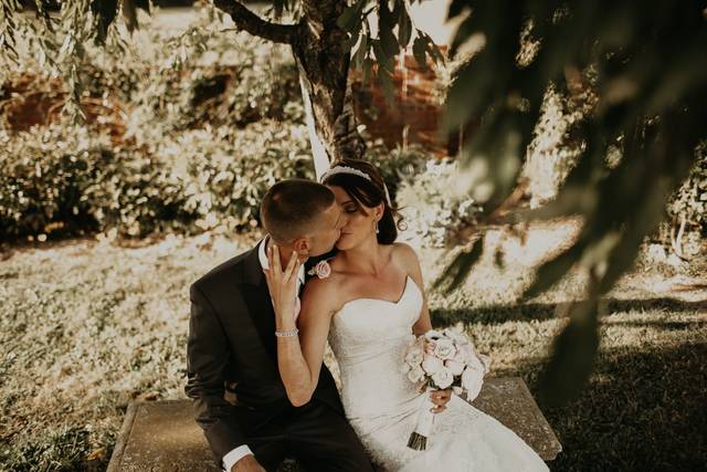 Bride and groom under tree