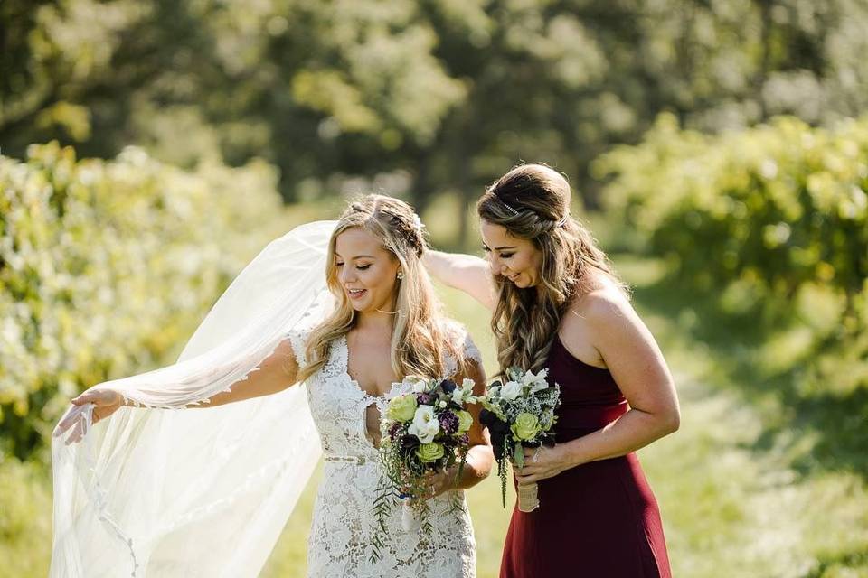 Bride and maid of honor in the field