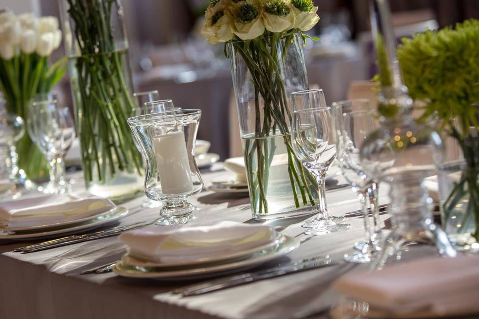 Table setting with floral and candle centerpiece