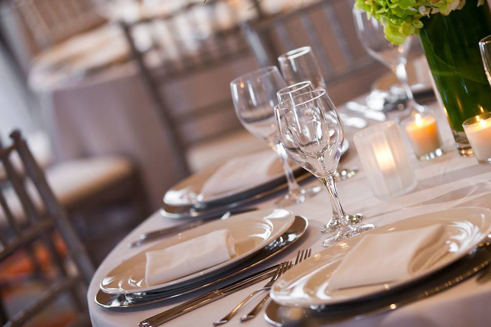 Table setting with floral and candle centerpiece