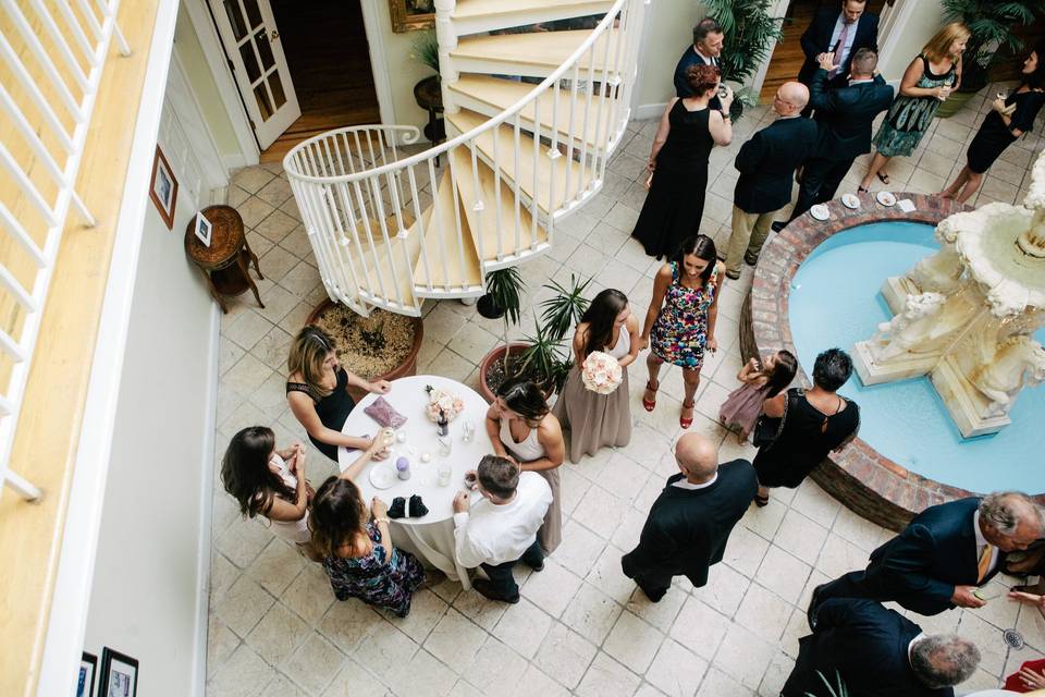 Drinks reception in the Atrium with beautiful indoor fountain