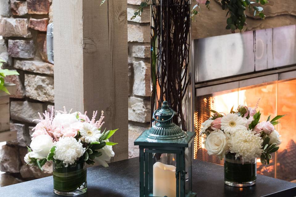 A fireside ceremony with flowers that can be moved to the reception and used for centerpieces
.