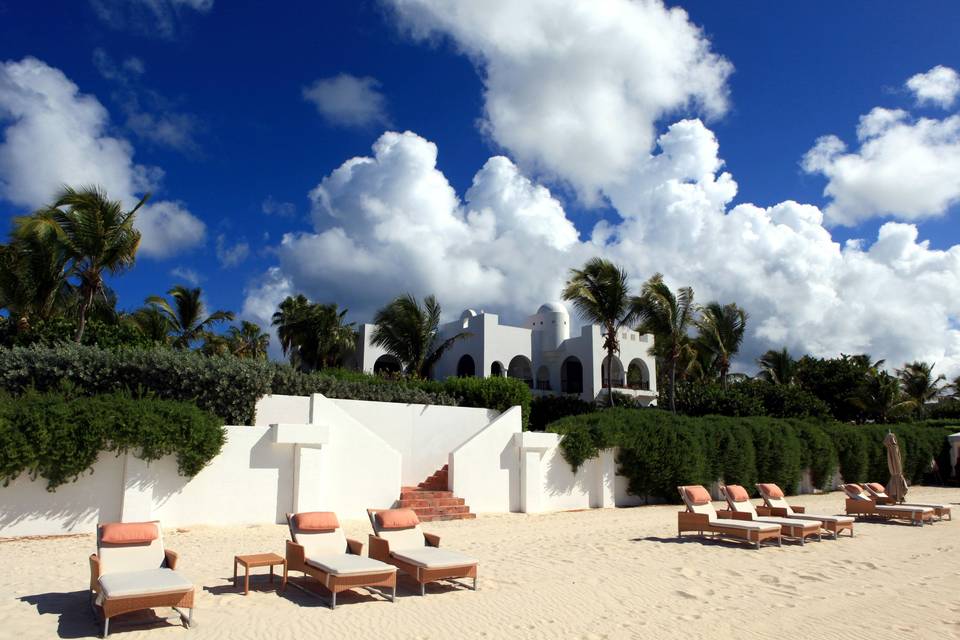 Over a mile of pristine white sand just steps from private villas at Cap Juluca.