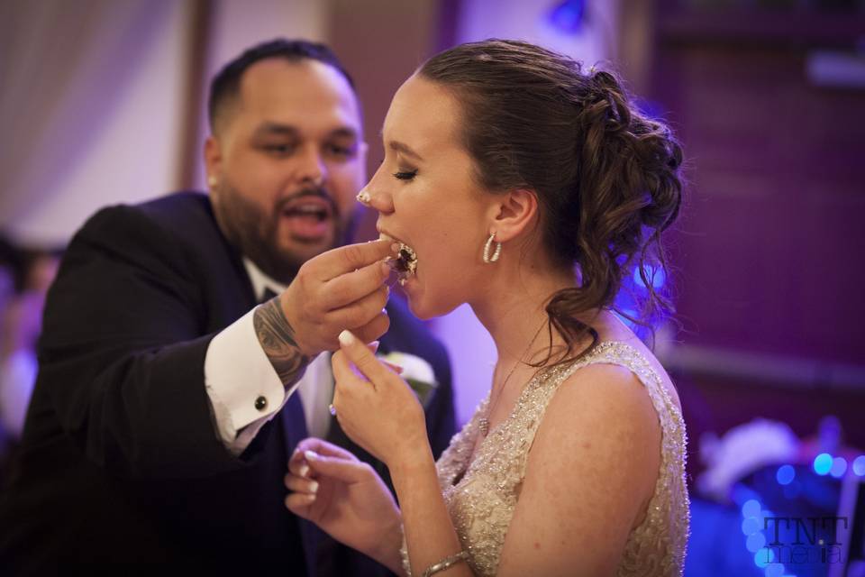 Couple eating their cake