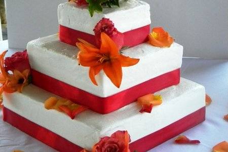 Orange cake with raspberry filling and fresh flowers