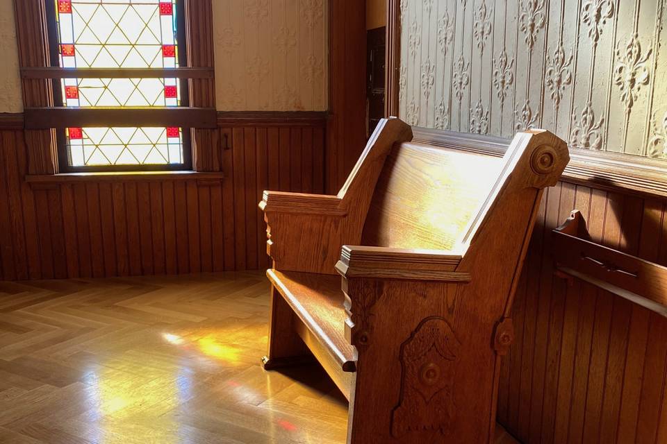 Original 1885 pew bench in the foyer