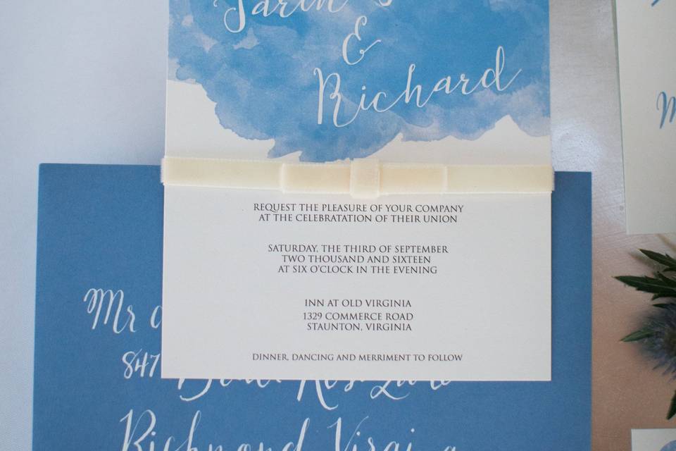 Blue and white invitation with velvet ribbon
