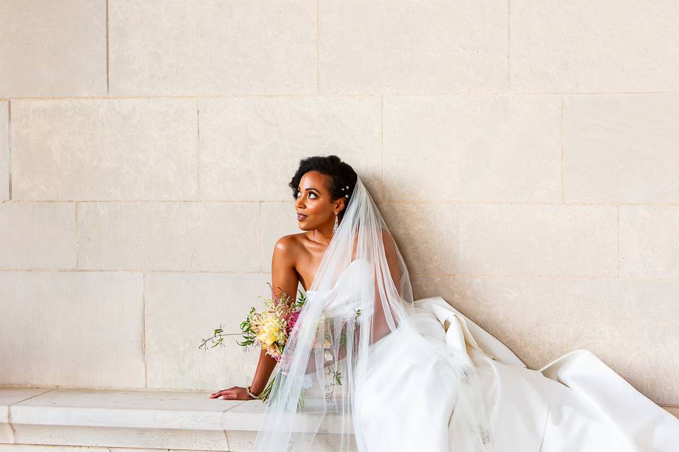 Bride leaned against the wall