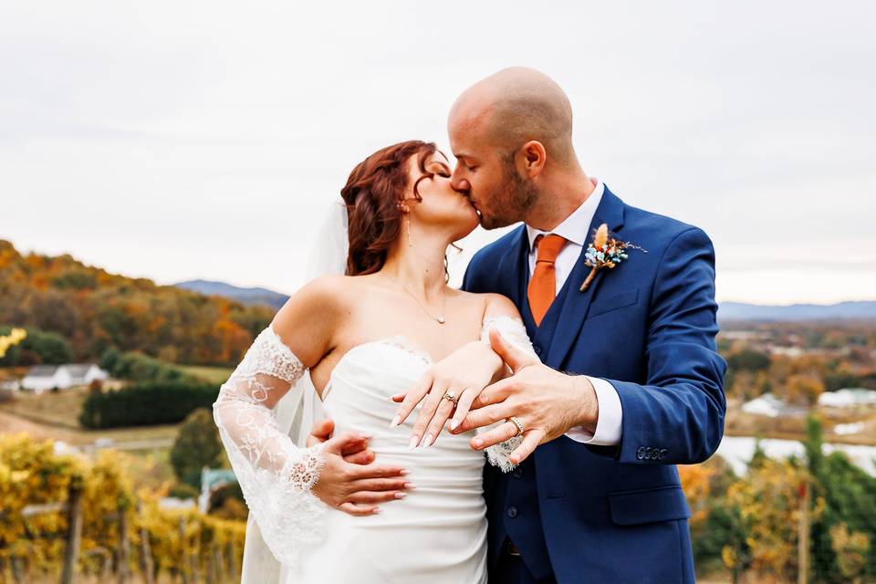 Couple kissing at vineyard