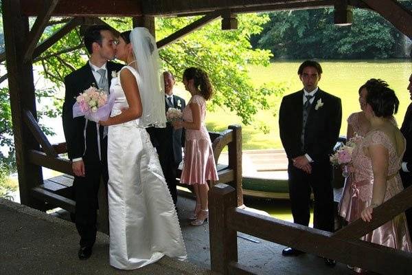 Chris and Adrianna sneak a kiss while doing portraits in Central Park, NYC.