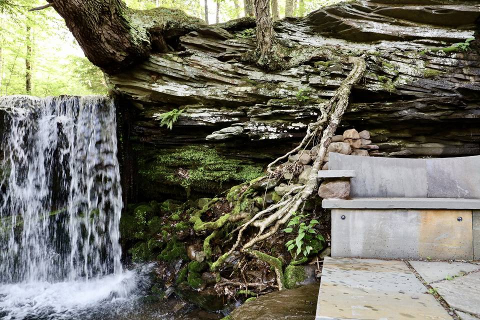 Waterfall and Stone Bench