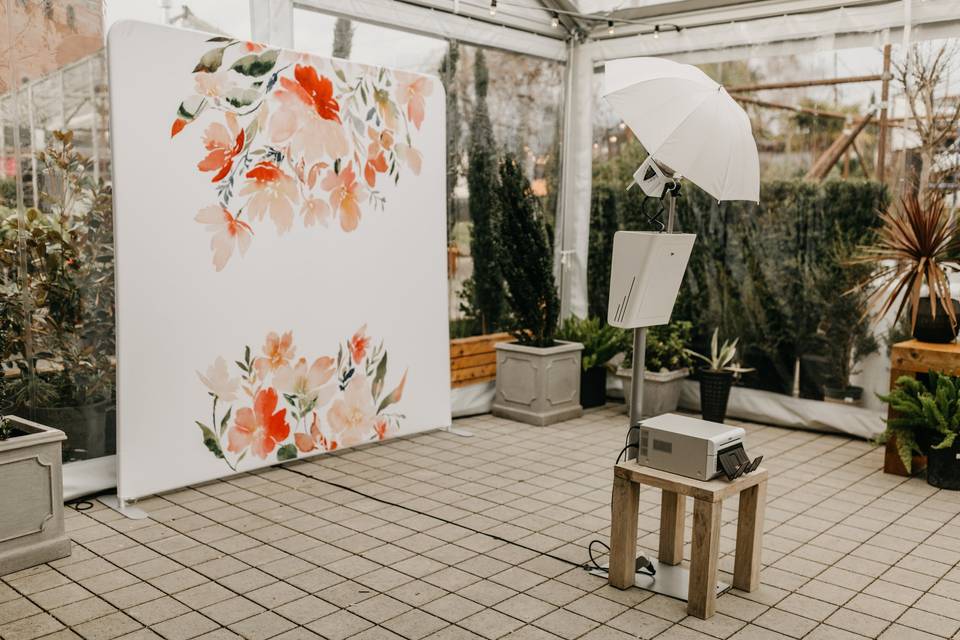 Open air booth with art backdrop