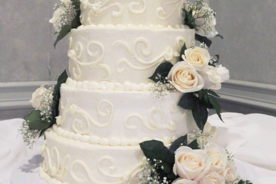 Multiple tiered buttercream cake at