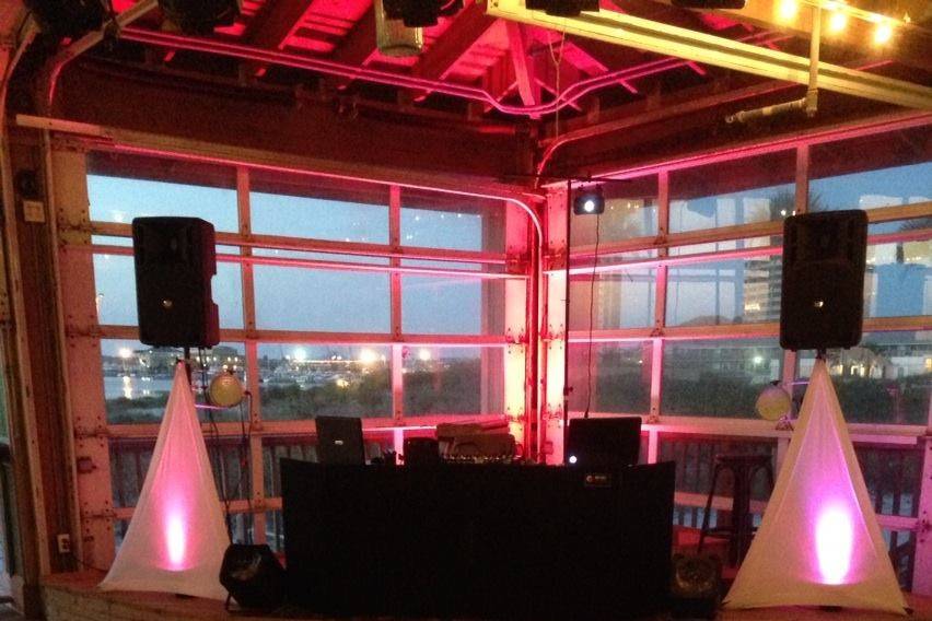 Our setup at Margaretville - Pensacola Beach. We had some pink up lighting with the custom monogram on the dance floor.