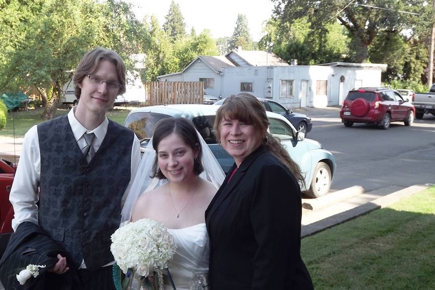 The couple with their officiant