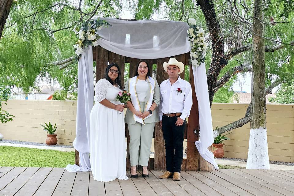 Officiant with the newlyweds